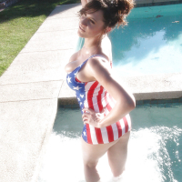 Pornstar in American flagthemed swimming suit Lana Kendrick has fun in pool