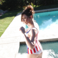 Pornstar in American flagthemed swimming suit Lana Kendrick has fun in pool