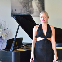 Jill Taylor hitches up her black dress and toys herself at the piano