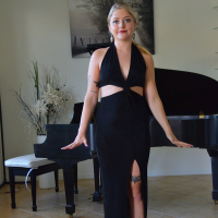 Jill Taylor hitches up her black dress and toys herself at the piano