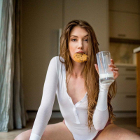 Naughty Elena Koshka plays with milk and cum