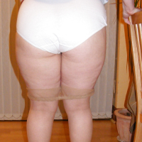 Slutty secretary in tights and white stilettos