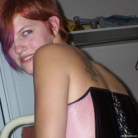 Pink hair cutie in a tight corset