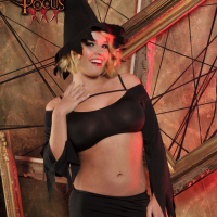 Busty witch Krissy Lynn is removing her sexy outfit to show her bald pussy