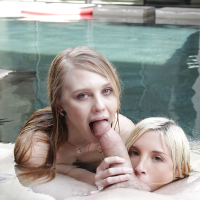 Young pornstars Lily Rader and Piper Perri give ball licking BJ in pool