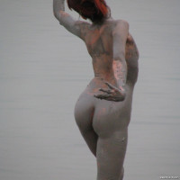 Slim girl posing naked on the beach