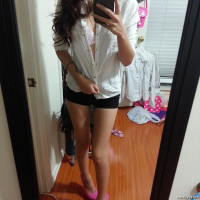 Beautiful young Asian babe likes to make naked selfies