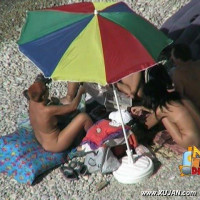 Threesome under the umbrella with two fine girls