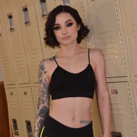 Slim tattooed chick Stevie Moon fucks some guy in the gyms locker room