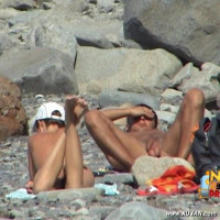 Nude couple filmed as they enjoy the sun