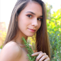 Cute brunette Leona Mia posing naked outdoors