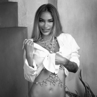Stunning chick Monika Fox unveils her big tits while posing