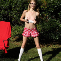 Kinky nerd Hannah Hays works a massive dildo into her twat in the yard