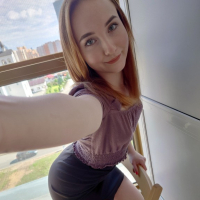 A petite pale redhead shows her nice tits