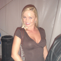 Blonde MILF Silvia Saint fully clothed posing flaunting big tits at party