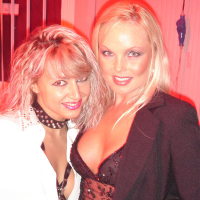 Blonde MILF Silvia Saint fully clothed posing flaunting big tits at party