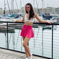 Young brunette Liz Jordan models a bikini at a marina before sex at home
