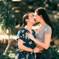 Pretty nurse Spencer Bradley shares a lesbian kiss with Liz Jordan