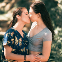 Pretty nurse Spencer Bradley shares a lesbian kiss with Liz Jordan
