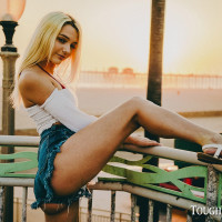 Blonde chick Kenna James models on a beach before an intense fuck indoors