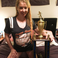 Naughty Girl Sunny Lane posing with her Trophy