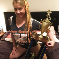Naughty Girl Sunny Lane posing with her Trophy