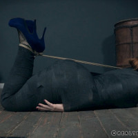 Redhead plumper Summer Hart has her ass turned red while restrained in dungeon