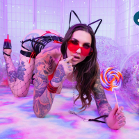 Tall tattooed model Rocky Emerson enjoys some sweet lollipop