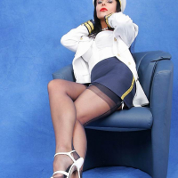 Stocking model Eve posing in sexy navy captain uniform
