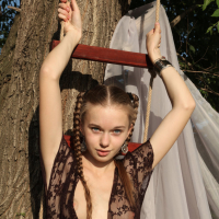 Hot teen European Milena D in pigtails flashing her hairy muff outdoors
