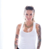 Tattooed babe Christy Mack uncovering her amazing booty and big jugs