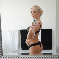 Beautiful blonde Tasha Reign taking selfies in mirror while removing pretties