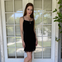Skinny brunette girl Nadia Noja drops down her sexy black dress