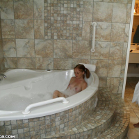 Pregnant Alyssa Hart gives a slippery bath handjob