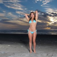 Beach babe Sara Luvv strips bikini to pose naked show small tits in the sand
