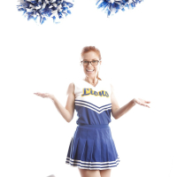 Cute redhead cheerleader Penny Pax in glasses baring big tits firm ass