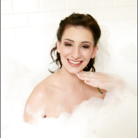 Hot babe September Carrino playing with soap sud in the bath