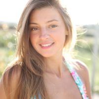 Gorgeous Melena Maria Rya posing in a bikini by the pool