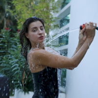 Hot Melena Maria Rya gets wet while posing in the backyard
