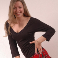 Cute girl Sarah shows off in her new plaid skirt