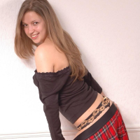 Cute girl Sarah shows off in her new plaid skirt