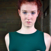Ashley Lane redhead bound in dungeon with leather and dribbling