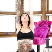 Tattooed Lily Lane in socks doffing yoga pants to show hot ass on knees