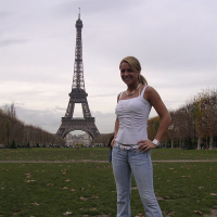 Cheerful blonde Shelby Bell posing in the streets of Paris
