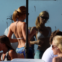 Paris Hilton showing her hard pokies in white transparent bikini top on the beac