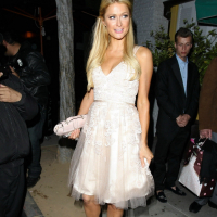 Paris Hilton showing big cleavage in cute white dress leaving restaurant in LA