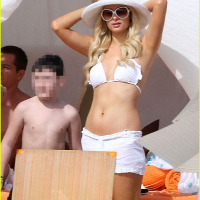 Paris Hilton wearing sexy white bikini seethrough shorts at the beach in Cabo
