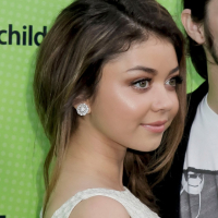 Sarah Hyland wearing retro white mini dress at the Skip And Donate Gala Event in