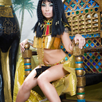 Brunette coed Rina Ellis peeling off Cleopatra themed cosplay outfit
