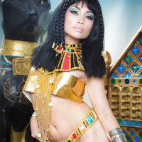 Brunette coed Rina Ellis peeling off Cleopatra themed cosplay outfit